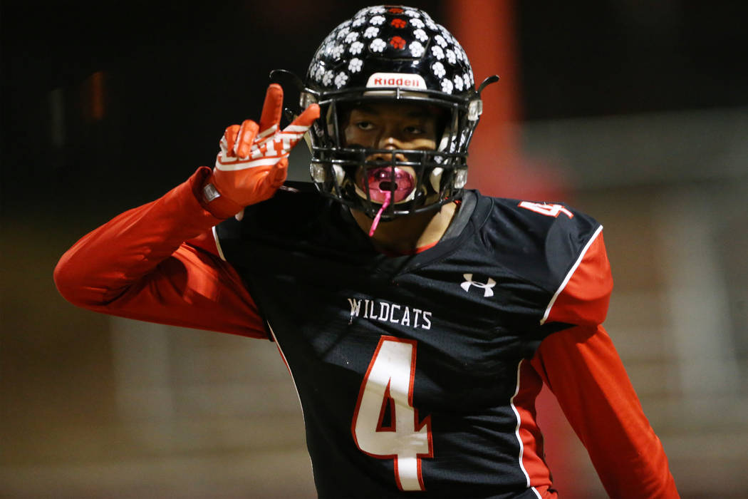 Las Vegas Victory David (4) celebrates a touchdown against Desert Pines in a football game at L ...