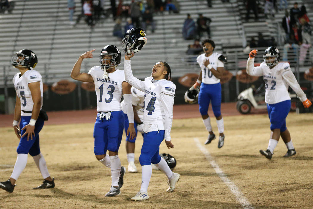 Desert Pines players from left, Rjay Tagataese (15), Michael Jackson (13), Luis Magana (64), Ma ...