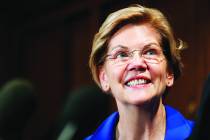 Sen. Elizabeth Warren, D-Mass., listens to Rep. Jim Clyburn, D-S.C., at an event about their bi ...