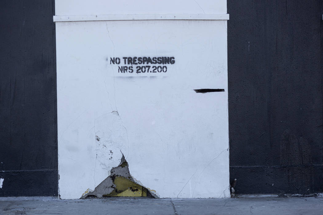 A no trespassing warning is shown on a wall outside the historic Huntridge Theater on Thursday, ...