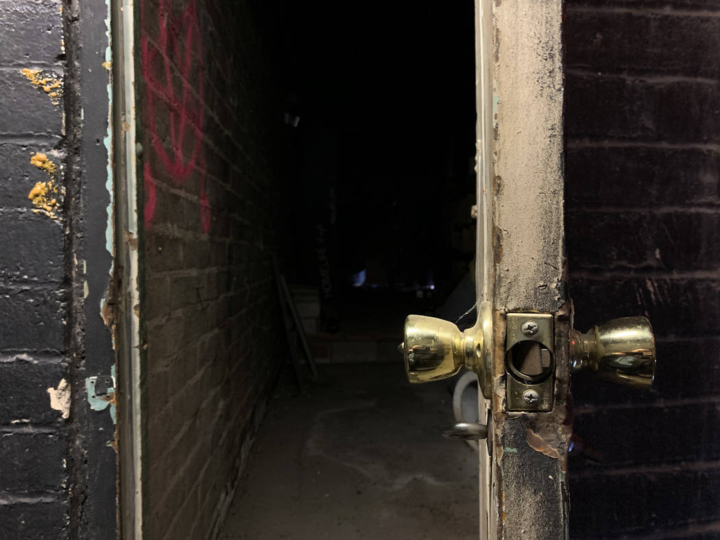 A doorway leads to an old bathroom inside the historic Huntridge Theater photographed on Thursd ...