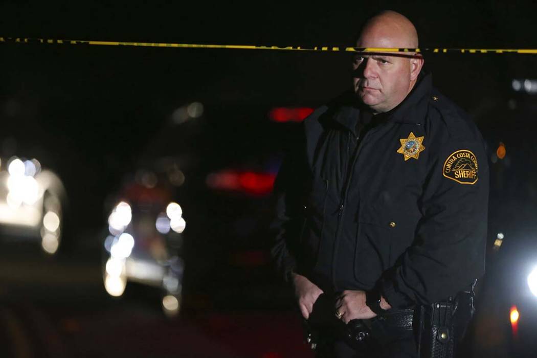 Contra Costa County Sheriff deputies investigate a multiple shooting in Orinda, Calif., on Thur ...