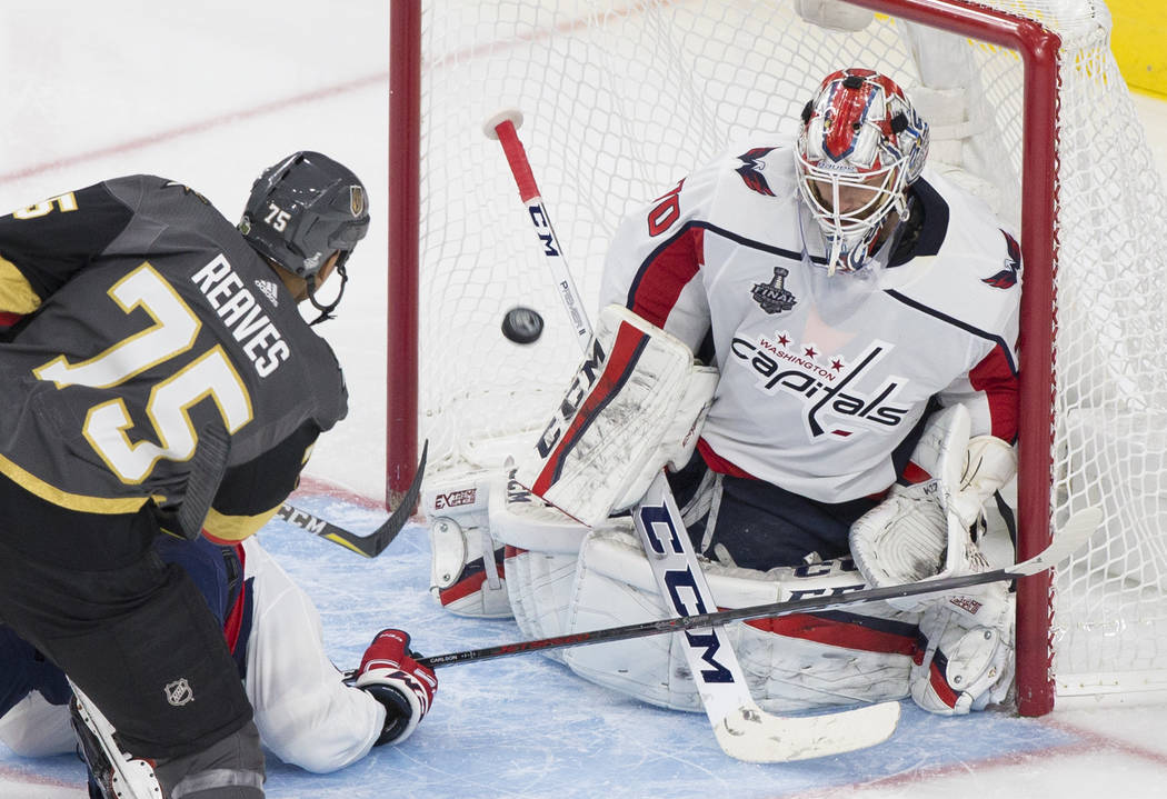Golden Knights right wing Ryan Reaves (75) scores a third-period goal against Capitals goaltend ...