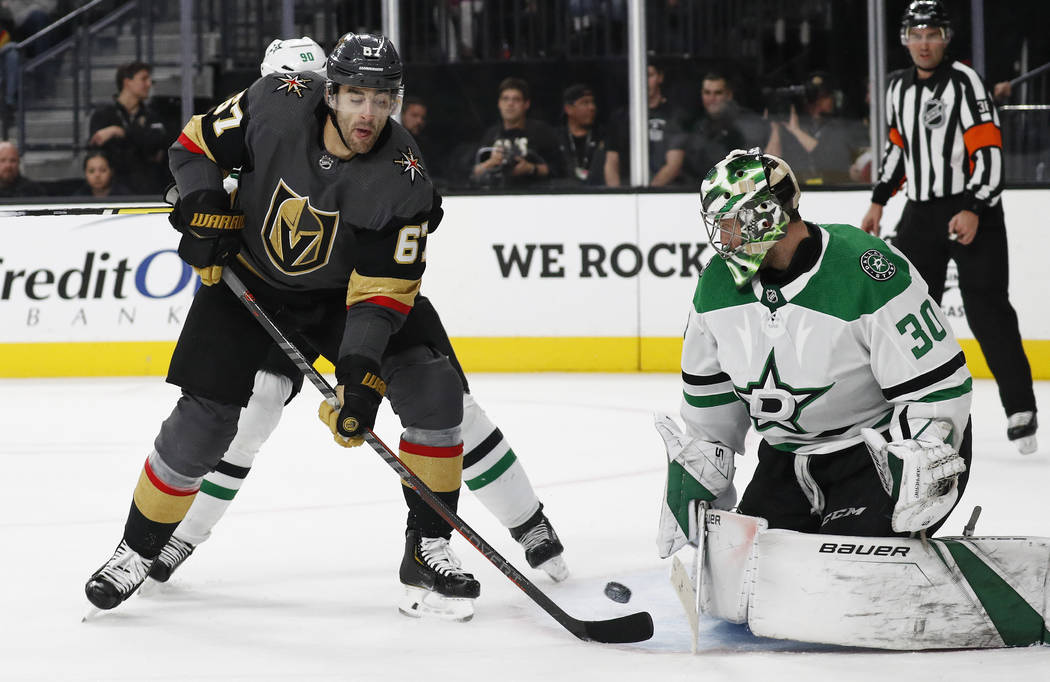 Vegas Golden Knights left wing Max Pacioretty (67) tries to tip the puck past Dallas Stars goal ...