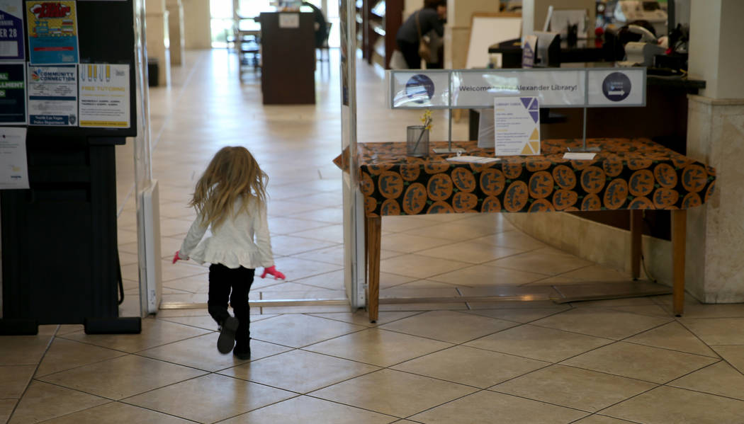 Hartley Tavano, 3, runs into Alexander Library in North Las Vegas Friday, Nov. 1, 2019. (K.M. C ...