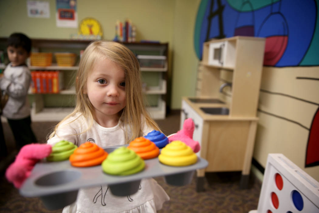 Hartley Tavano, 3, offers cupcakes at Alexander Library in North Las Vegas Friday, Nov. 1, 2019 ...