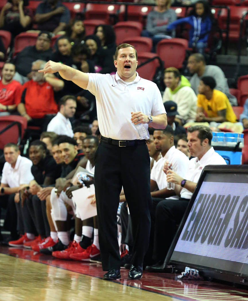 UNLV's basketball head coach T.J. Otzelberger directs his players during the second half of the ...