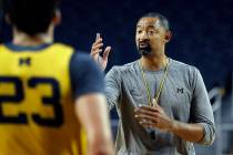 Michigan head coach Juwan Howard directs his team during NCAA college basketball practice in An ...