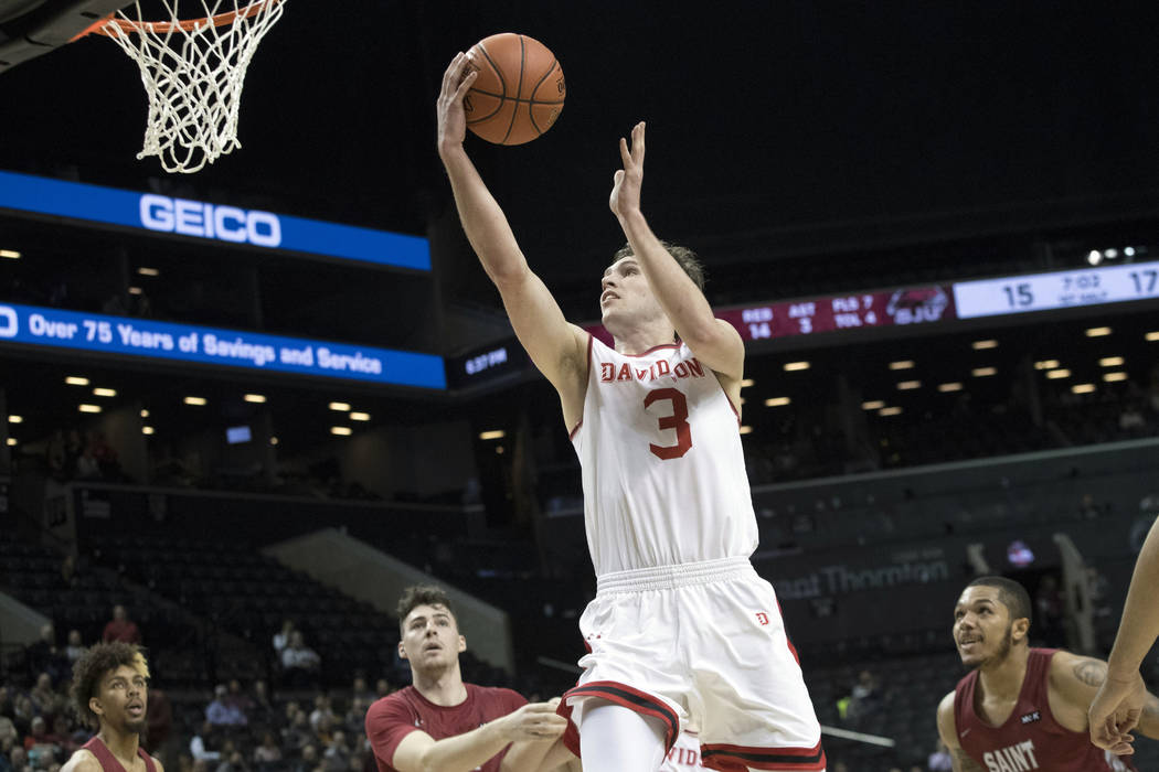 Davidson guard Jon Axel Gudmundsson (3) goes to the basket during the first half of the team's ...