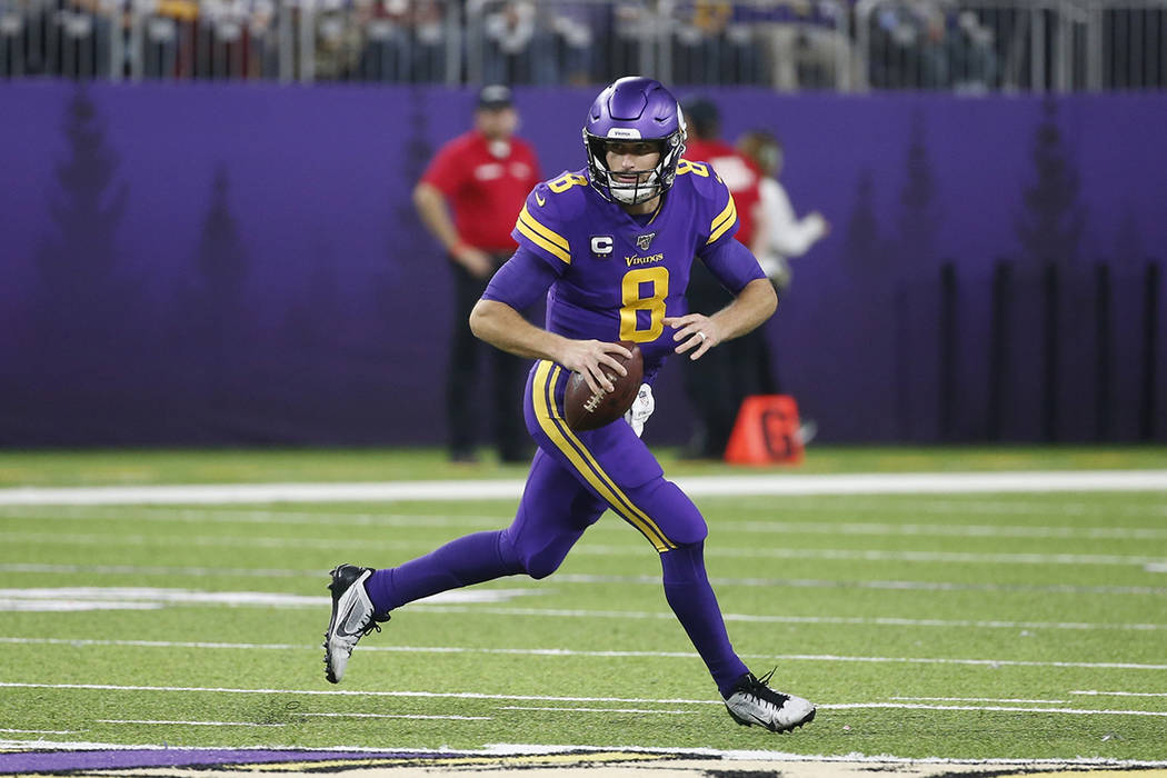 Minnesota Vikings quarterback Kirk Cousins (8) throws a pass during the second half of an NFL f ...
