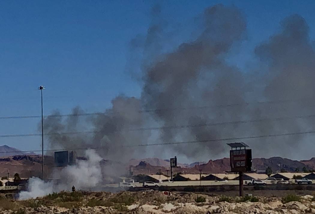 A brush fire burns near U.S. 95 and Galleria Drive on Saturday, Nov. 2, 2019. Henderson firefig ...