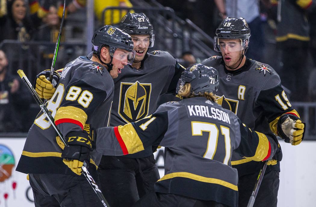 Vegas Golden Knights defenseman Nate Schmidt (88) celebrates his goal with teammates over the W ...