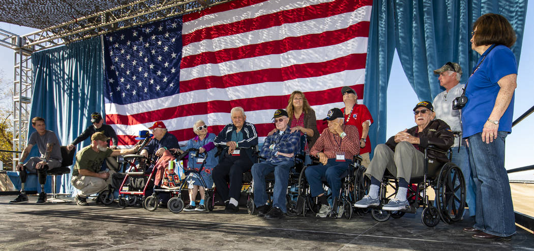 Rich Hillis with One Hero at a Time, left, talks with WWII and Korean War veterans during the 1 ...