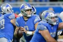 Detroit Lions quarterback Matthew Stafford looks downfield during the first half of an NFL foot ...