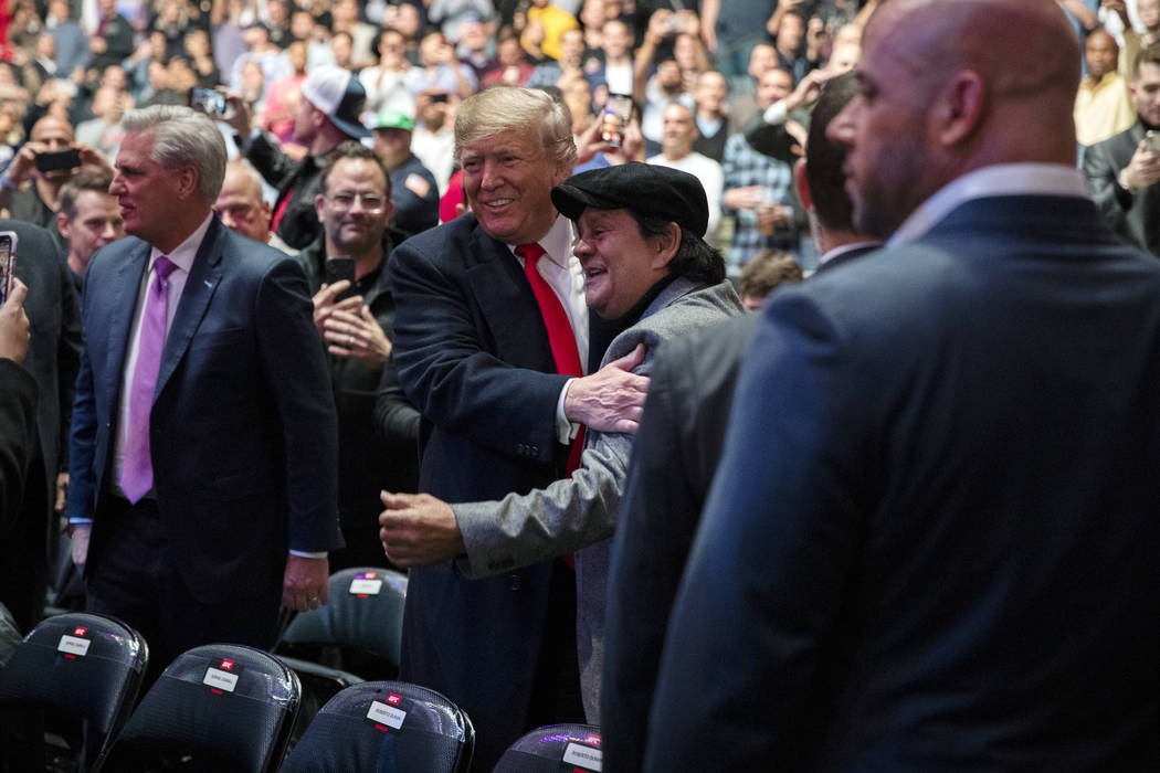 President Donald Trump talks with boxing legend Roberto Duran at Madison Square Garden during t ...