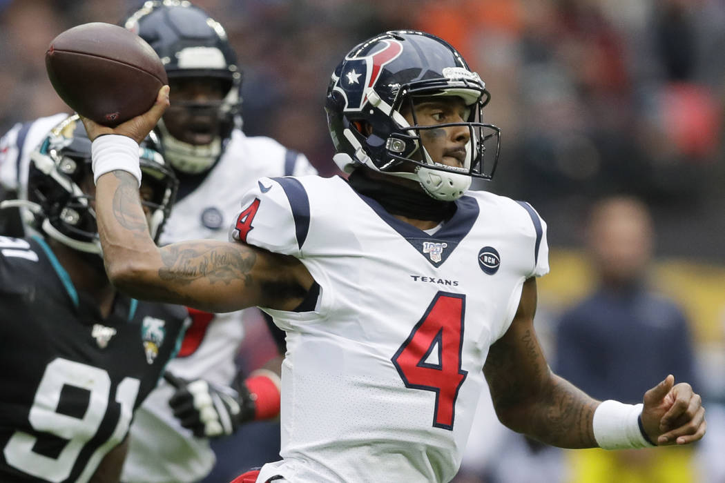 Houston Texans quarterback Deshaun Watson (4) runs out of the pocket under pressure by Jacksonv ...