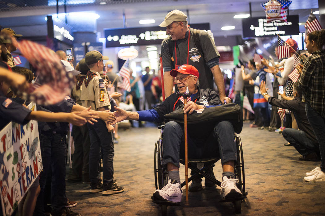 David Miller, a veteran of the U.S. Navy, greets supporters after visiting the veteran memorial ...