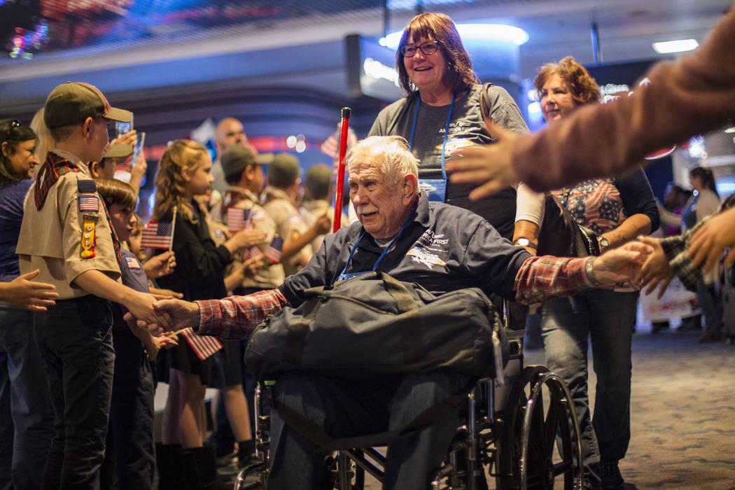 Frank Walls, a veteran of the U.S. Air Force, greets supporters after visiting the veteran memo ...