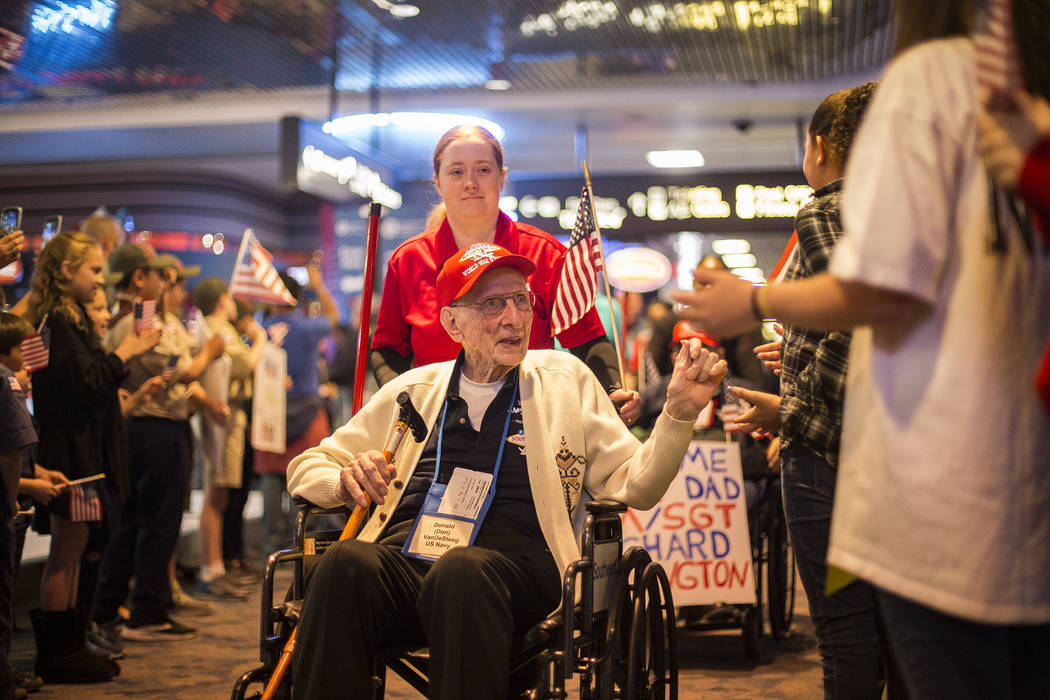 Donald Van De Steeg, a veteran of the U.S. Navy, greets supporters after visiting the veteran m ...