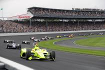 In a May 26, 2019, file photo, Simon Pagenaud, of France, leads the field through the first tur ...