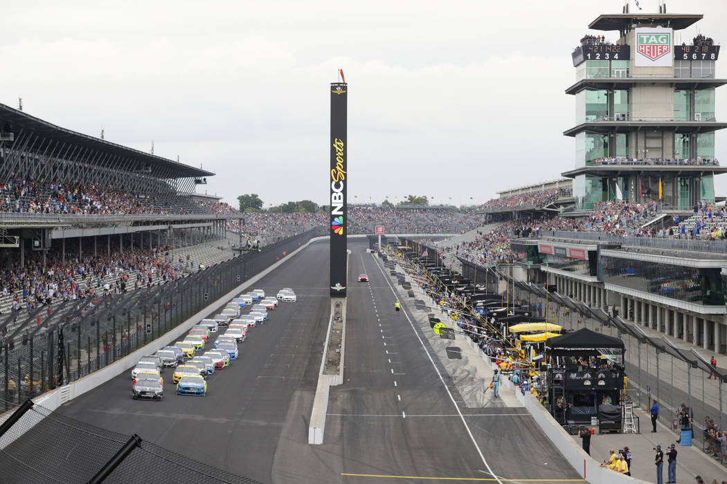 FILE - In this Sept. 8, 2019, file photo, Kevin Harvick, left, and Paul Menard lead the field i ...