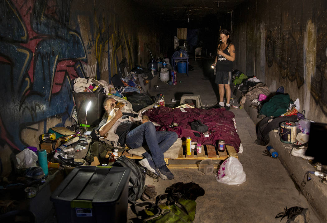 A homeless couple is pictured at home in the drainage tunnels near Dean Martin Drive in Las Veg ...