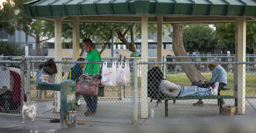 Possessions hang on the chainlink fence about a homeless encampment at Molasky Family Park off ...