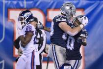 Dallas Cowboys tight end Blake Jarwin, center, celebrates with wide receiver Tavon Austin after ...