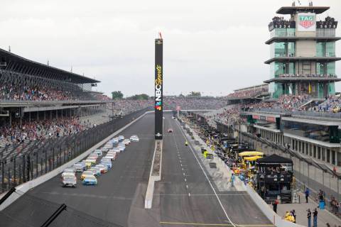 In this Sept. 8, 2019, file photo, Kevin Harvick, left, and Paul Menard lead the field into the ...