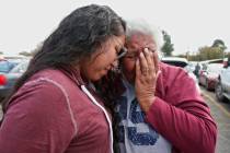 Tess Harjo, left, embraces her grandmother, Sally Taylor, right, after being released from the ...