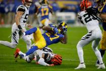 Los Angeles Rams running back Darrell Henderson (27) is tackled by Cincinnati Bengals free safe ...