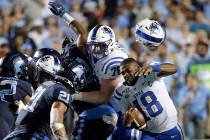 Duke quarterback Quentin Harris (18) loses his helmet during the second half of an NCAA college ...