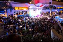 Attendees dance to Saint Jhn around the outdoor area the during the grand opening weekend of Ka ...