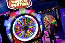 A Wheel of Fortune slot machine is seen at the IGT booth during the Global Gaming Expo, Wednesd ...