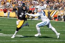 Pittsburgh Steelers quarterback Mason Rudolph (2) scrambles away from Indianapolis Colts defens ...