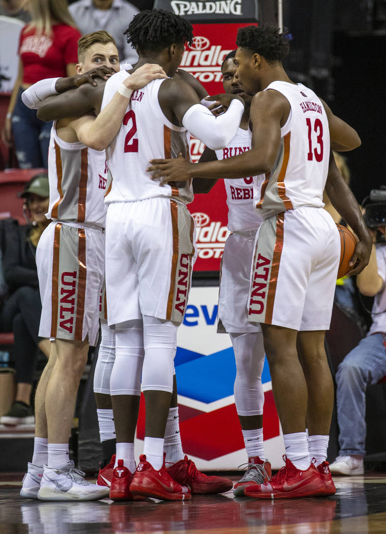UNLV Rebels players huddle after a foul call versus Purdue Fort Wayne during the first half of ...