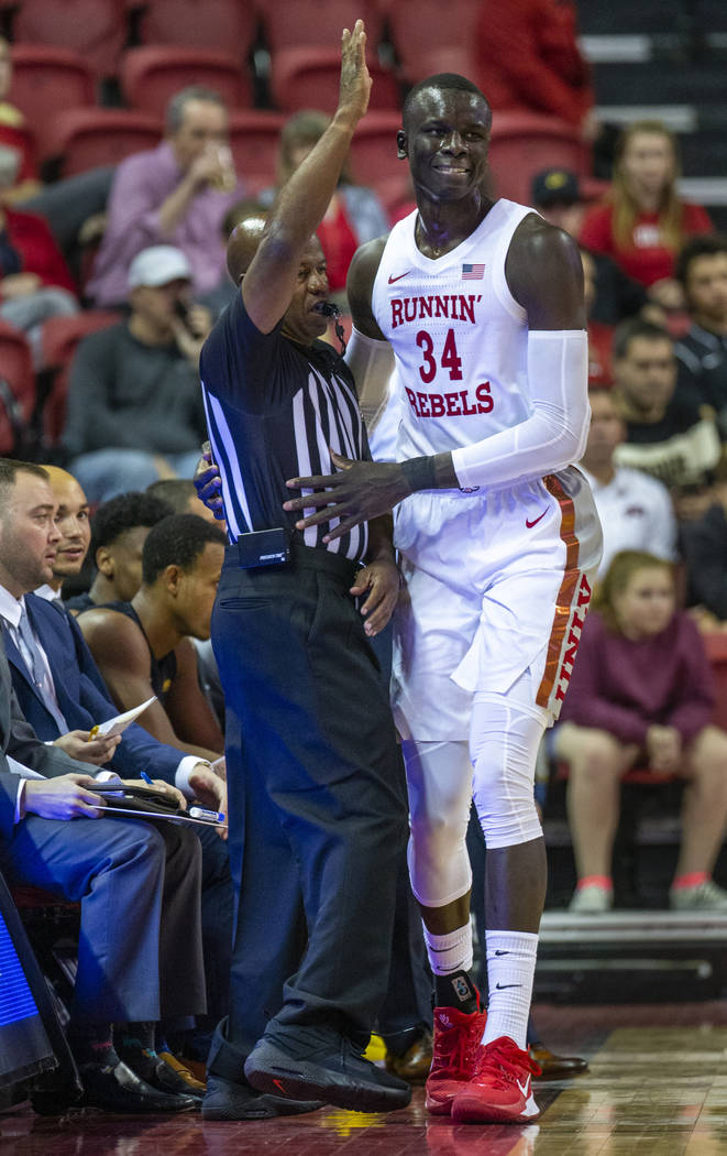 UNLV Rebels forward Cheikh Mbacke Diong (34) catches a referee after running out of bounds to c ...