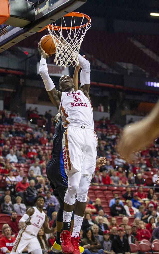 UNLV Rebels forward Cheikh Mbacke Diong (34) goes up for another dunk over Purdue Fort Wayne du ...
