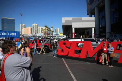 People attend the SEMA show at the Las Vegas Convention Center in Las Vegas, Tuesday, Nov. 5, 2 ...