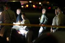 Las Vegas police officers respond Tuesday, Nov. 5, 2019, to a fatal shooting near Jones Bouleva ...