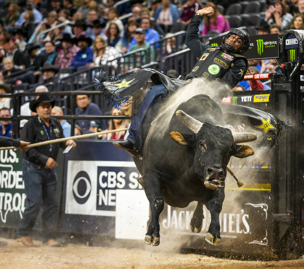 Luciano De Castro hangs tight atop Gangster Party during the PBR World Finals at T-Mobile Arena ...