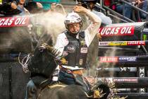 Mason Taylor rides El Big Bad for just under eight seconds during the PBR World Finals at T-Mob ...