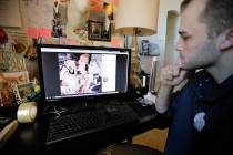 Austin Cloes, a Utah relative of the Americans killed in Mexico, looks at a photo of the childr ...