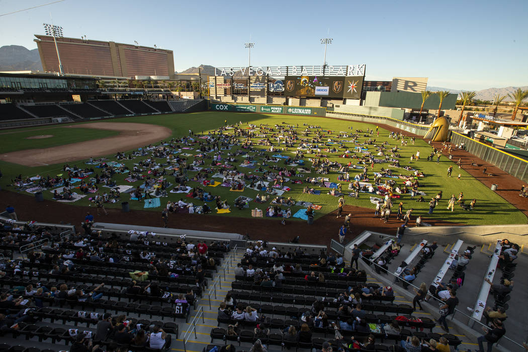 Fans relax on the field and in the stands during the first Vegas Golden Knights watch party as ...