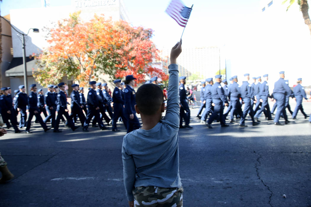 Matthew Goins, 6, of Las Vegas watches the Veterans Day Parade in downtown Las Vegas Monday, No ...