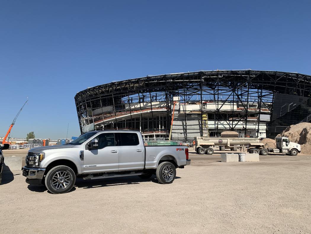 A Ford truck sits in front of Allegiant Stadium in Las Vegas after the company was announced as ...