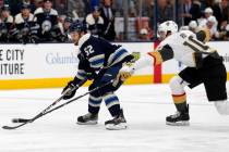 Columbus Blue Jackets forward Emil Bemstrom, left, of Sweden, controls the puck in front of Veg ...