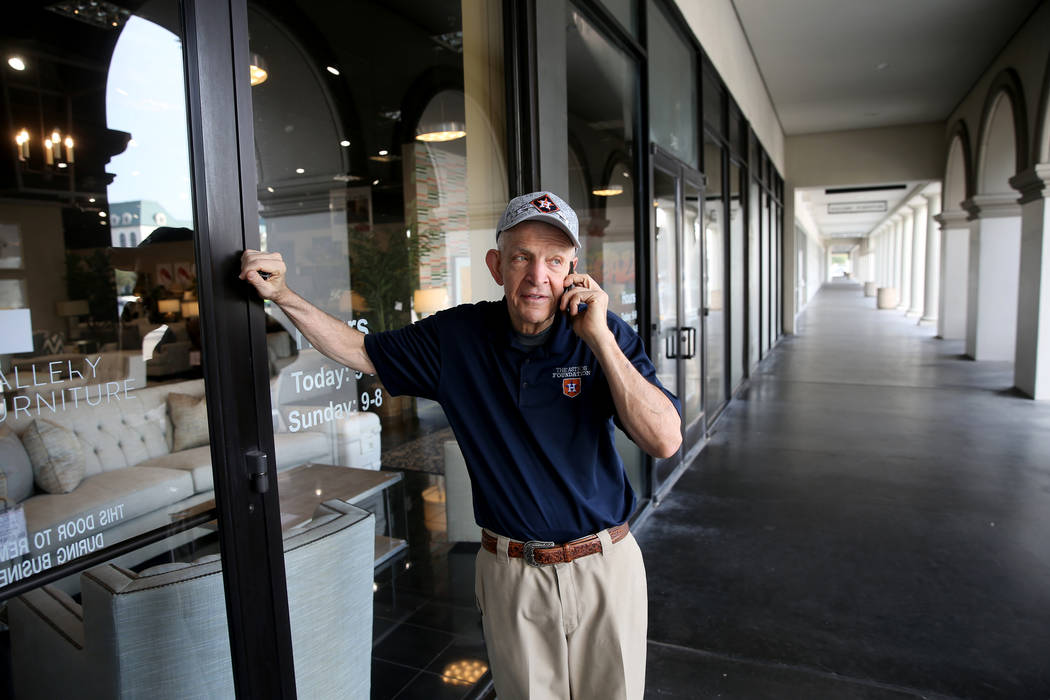 Houston furniture store owner Jim "Mattress Mack" McIngvale, 68, finishes a phone cal ...