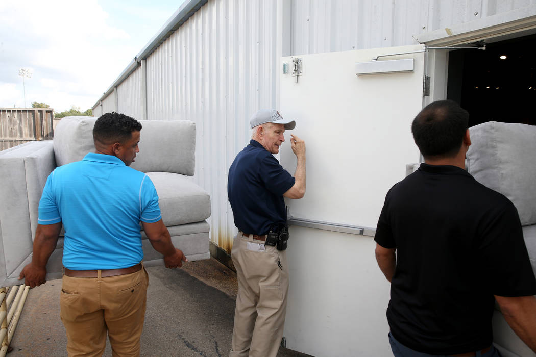 Houston furniture store owner Jim "Mattress Mack" McIngvale, 68, center, directs setu ...