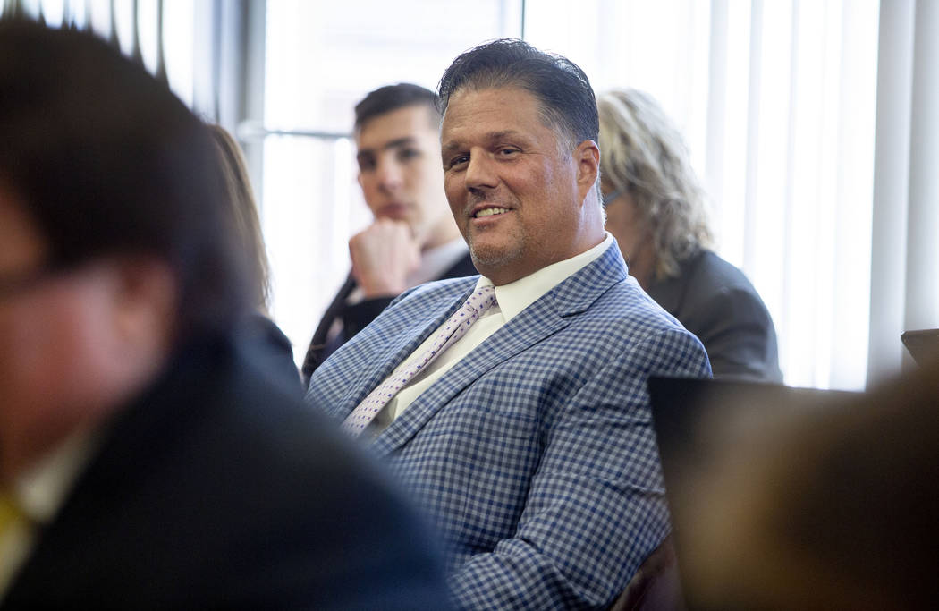 Las Vegas resident David Harold Moore listens as a letter of resignation from Nevada dental boa ...